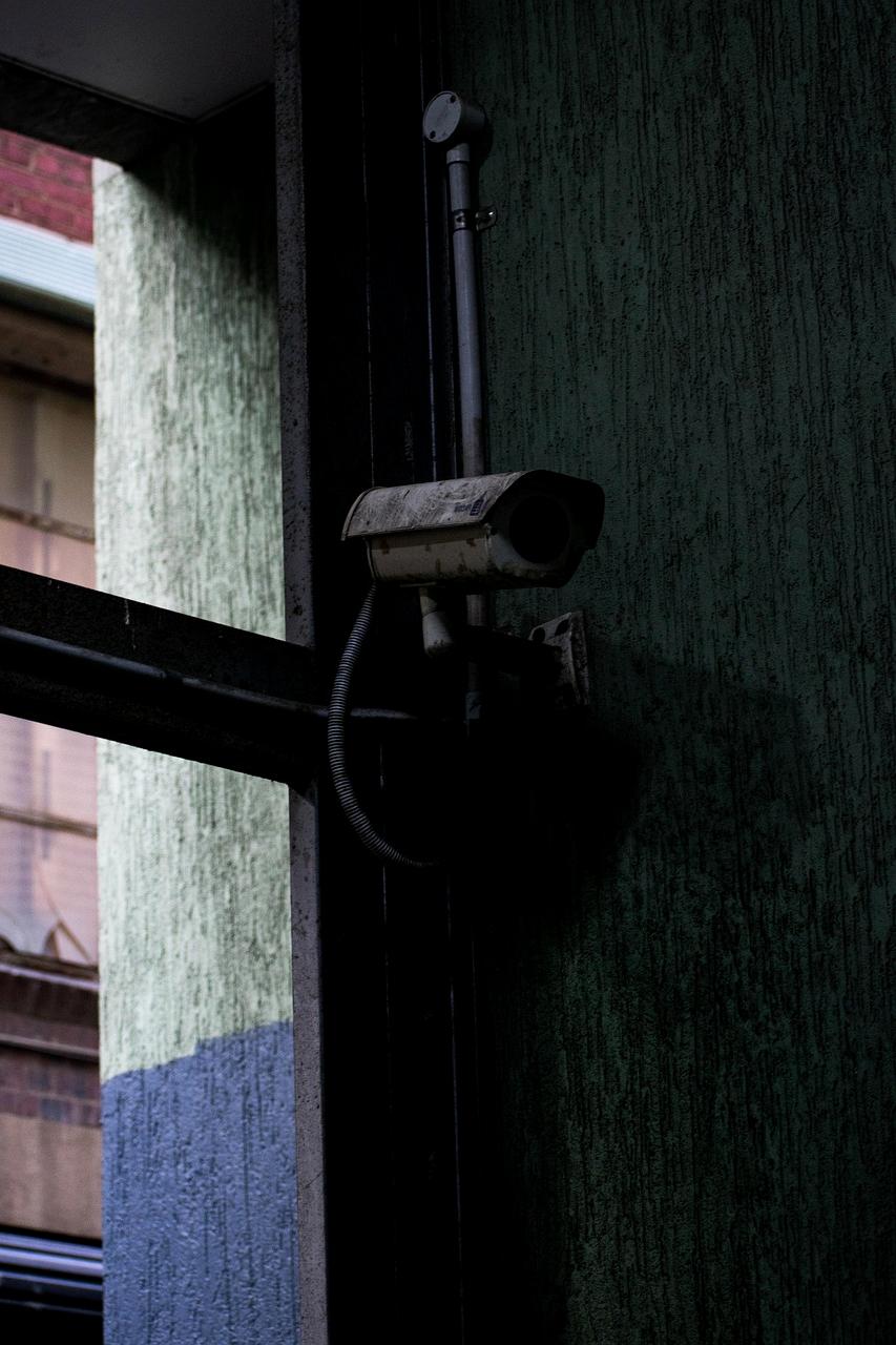 Security camera monitoring home exterior